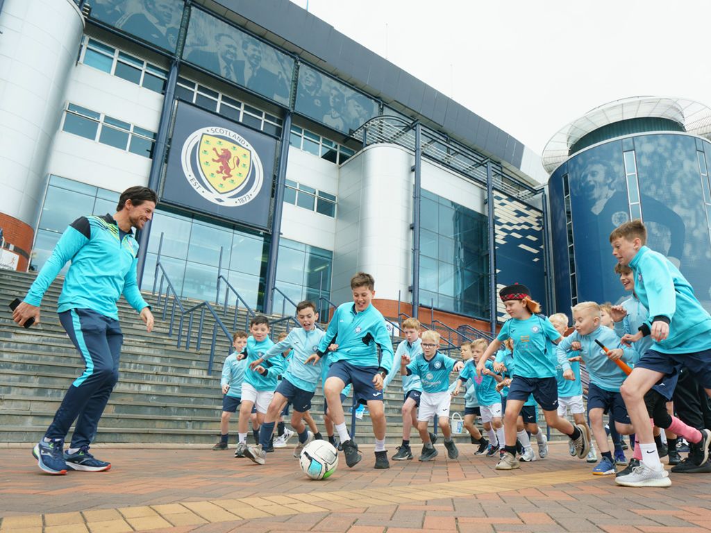 Balls for all: Charitable school kids dribble all the way from Scotstoun to Hampden