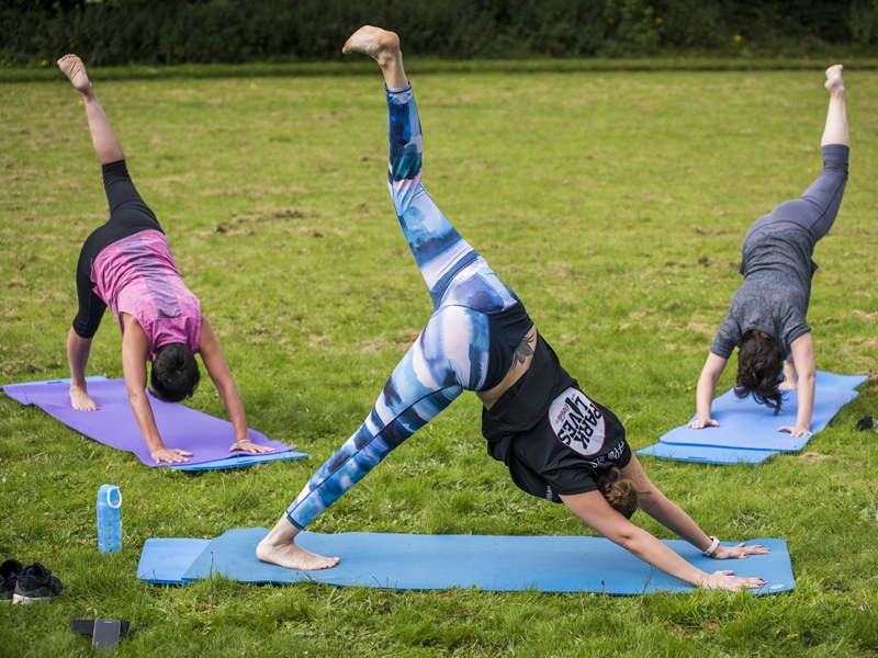 Glaswegians perfect their downward dog at free yoga sessions in city park
