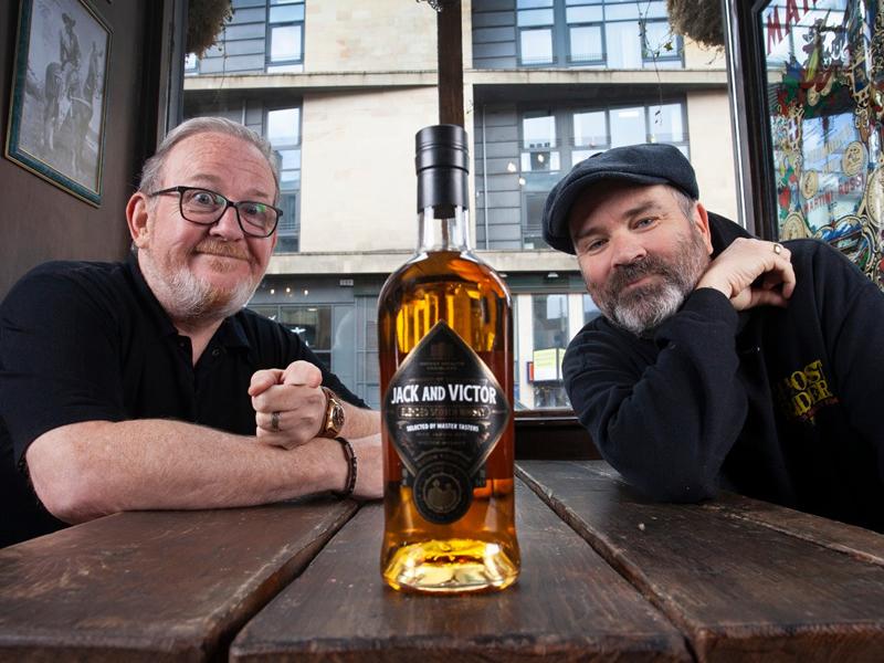 Jack and Victor raise a glass as whisky goes live